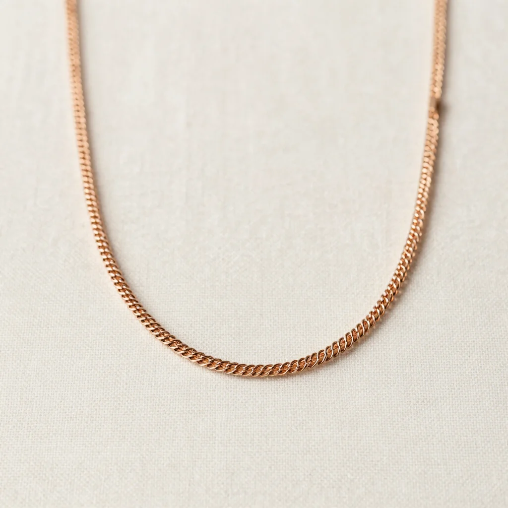 fine mesh necklace detail on textured white cotton fabric, gentle lighting, subtle shadows, elegant minimalist jewelry p